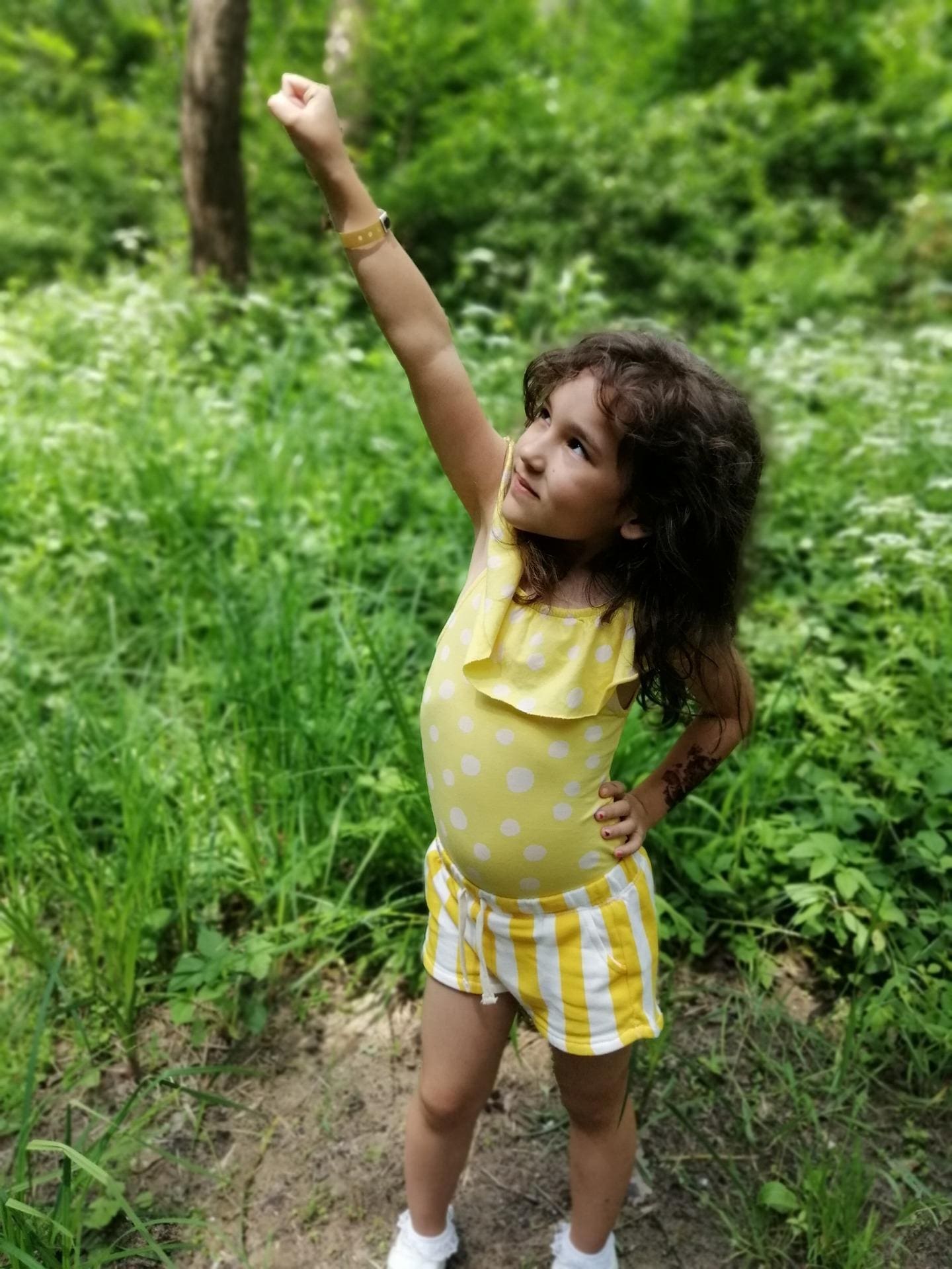 Photograph of a small girl proud of herself.
