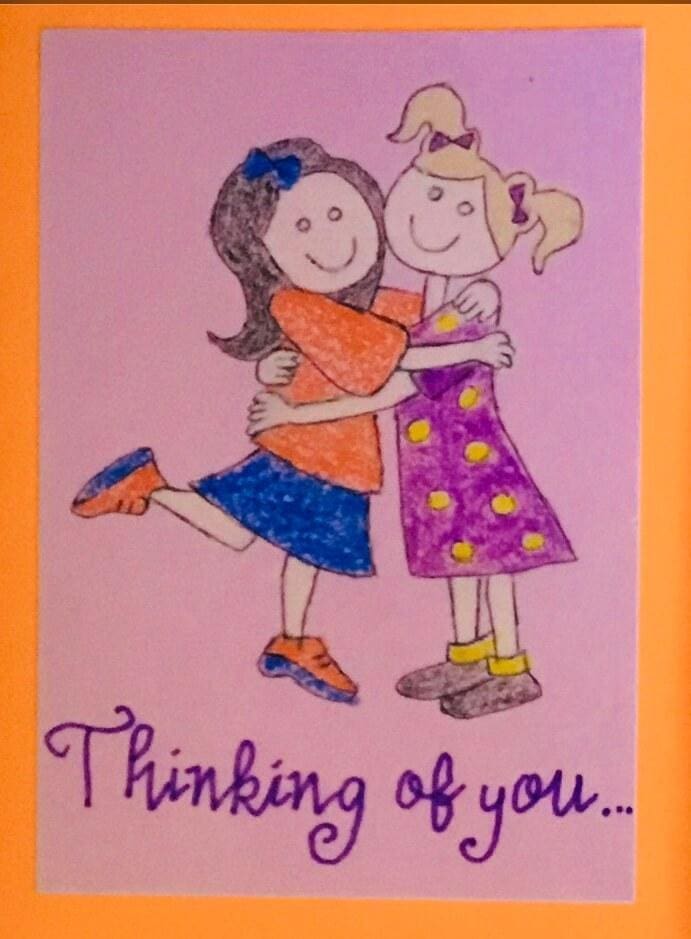 Drawing by Sumita Bose of two girls hugging each other. On the card it is written Thinking of you.