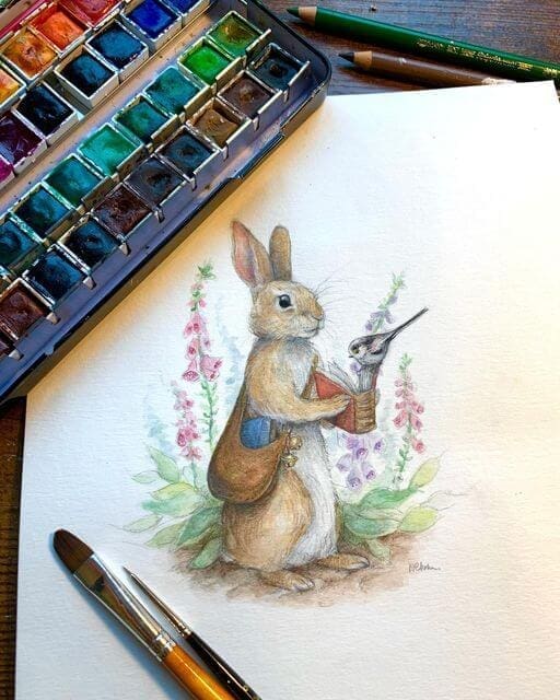 Painting in watercolors by Natacha Chohra, representing a small rabbit, similar to Peter Rabbit, the fictional animal character in Beatrix Potter's children's stories. The rabbit is holding in its paws a book and on this book sits a small little bird, trying to catch a look at the book's content. The rabbit has around its body a bag, in which he has another book. In the background wild flowers are growing.