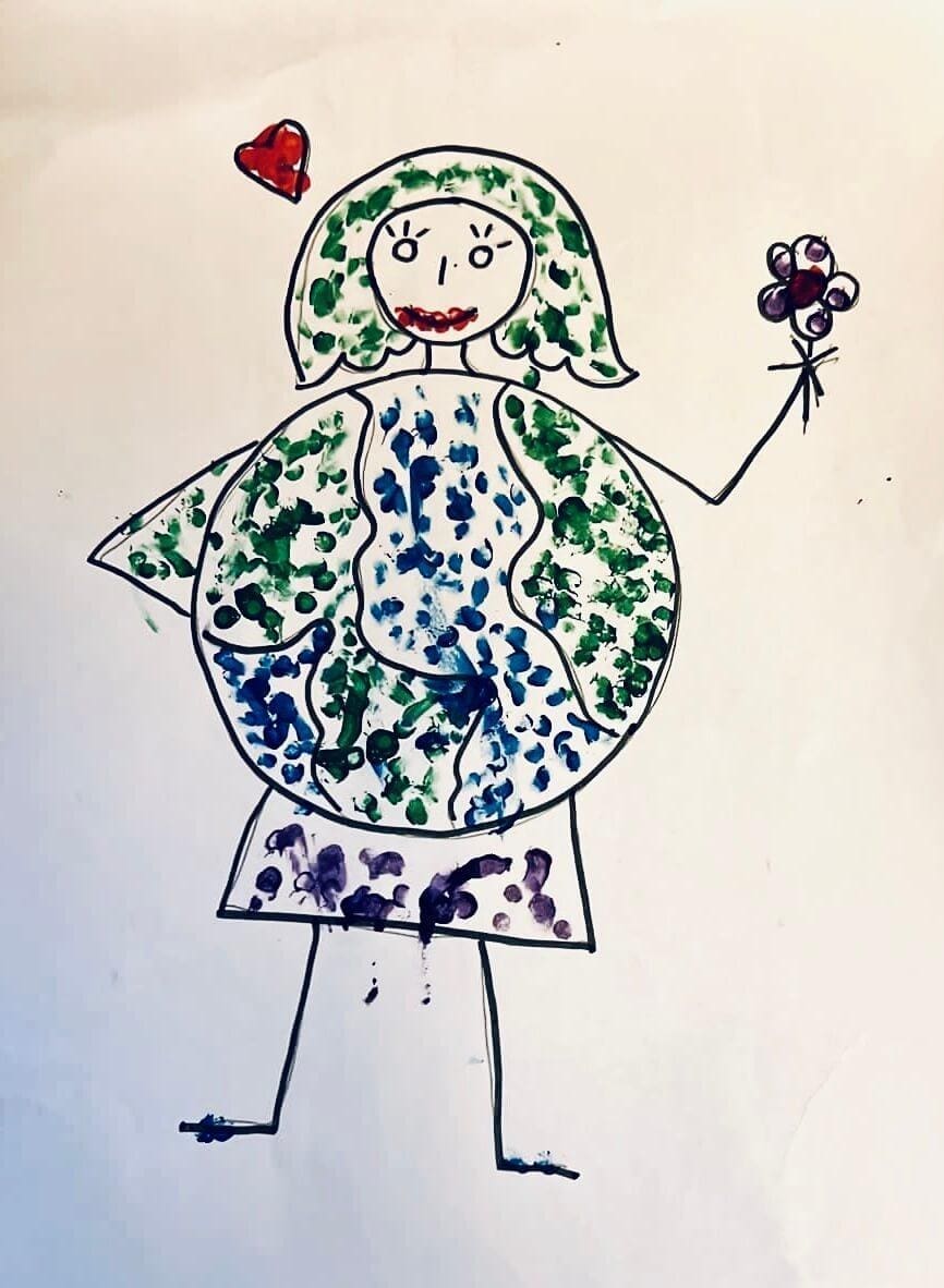 Child drawing by young artist Jayden Bose, representing Mother Earth with a heart and a flower.