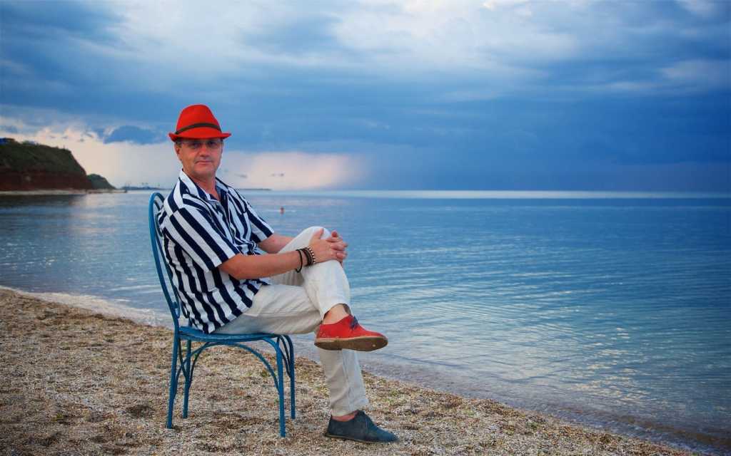 Romanian photographer Aurel Virlan with the Black Sea as background Vama Veche Romania.